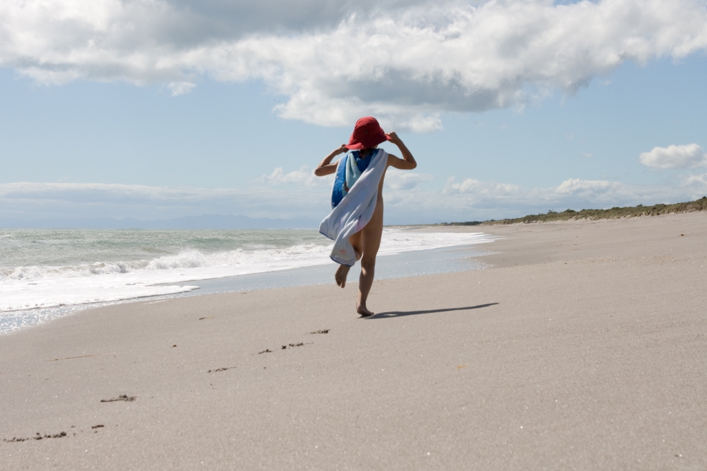 Sonnenschutz in Neuseeland Strand mit Kind